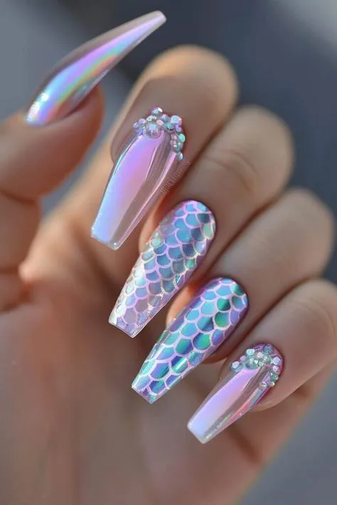This photo perfectly shows a classic take on mermaid nails ideas, featuring shimmering, iridescent polish and an eye-catching 3D scale texture that truly catches the light.