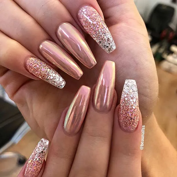 A glamorous manicure featuring classy wedding nails glitter with a trendy rose gold chrome and sparkling ombre design.